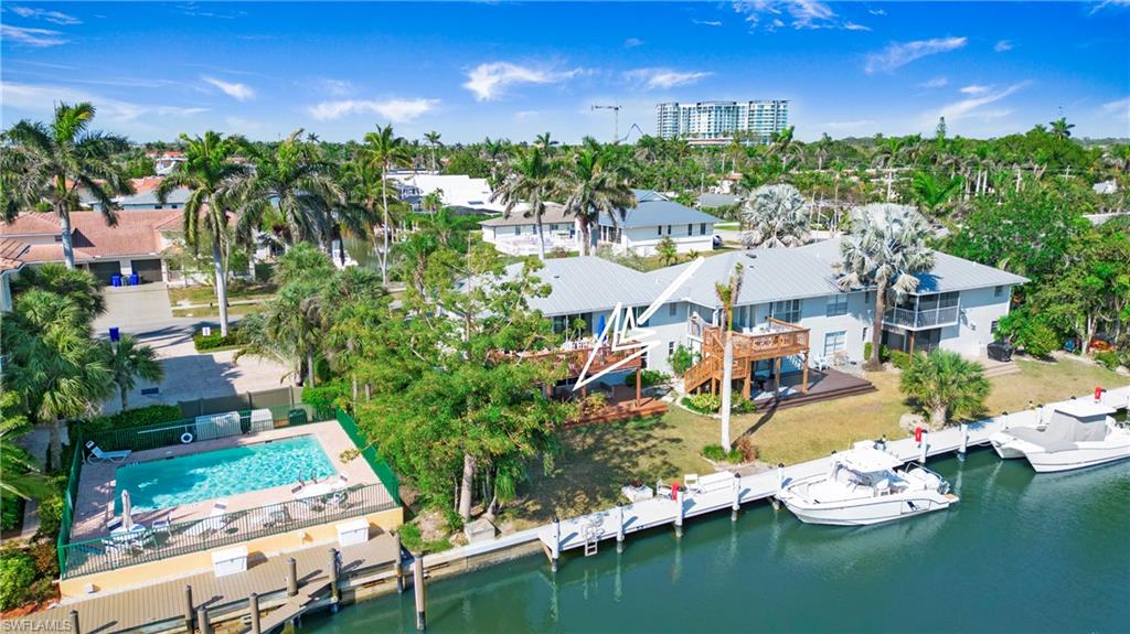 1560 Blue Point Avenue, Unit 3 Naples, FL 34102 - Photo 2 of 27 a view of an ocean with city view