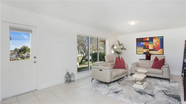 a living room with furniture and a rug