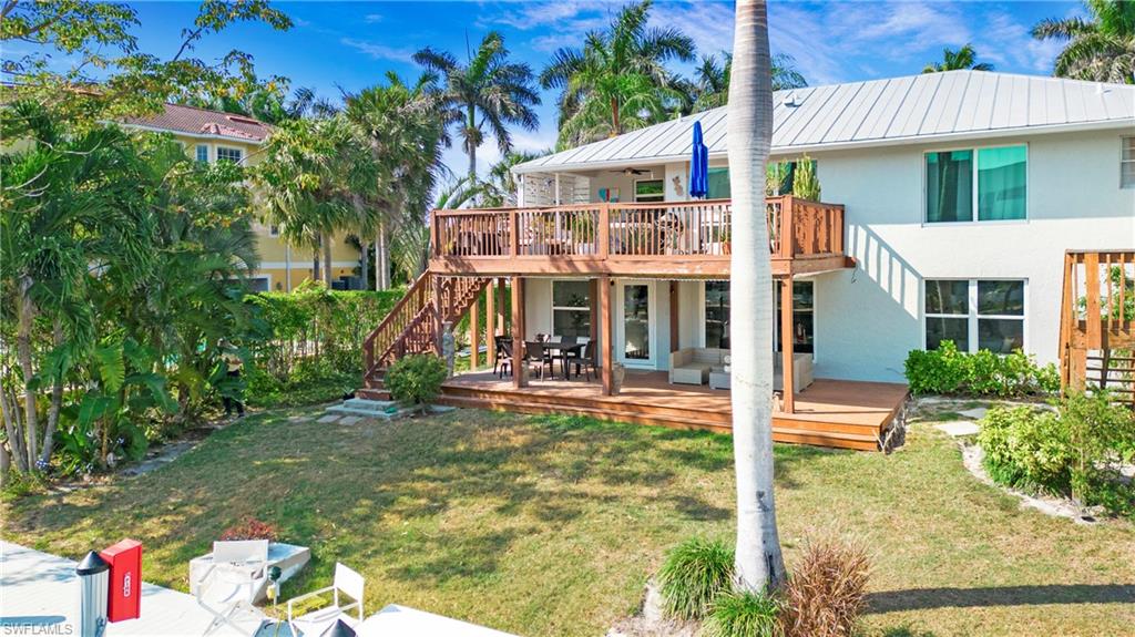 1560 Blue Point Avenue, Unit 3 Naples, FL 34102 - Photo 7 of 27 front view of a house with a yard