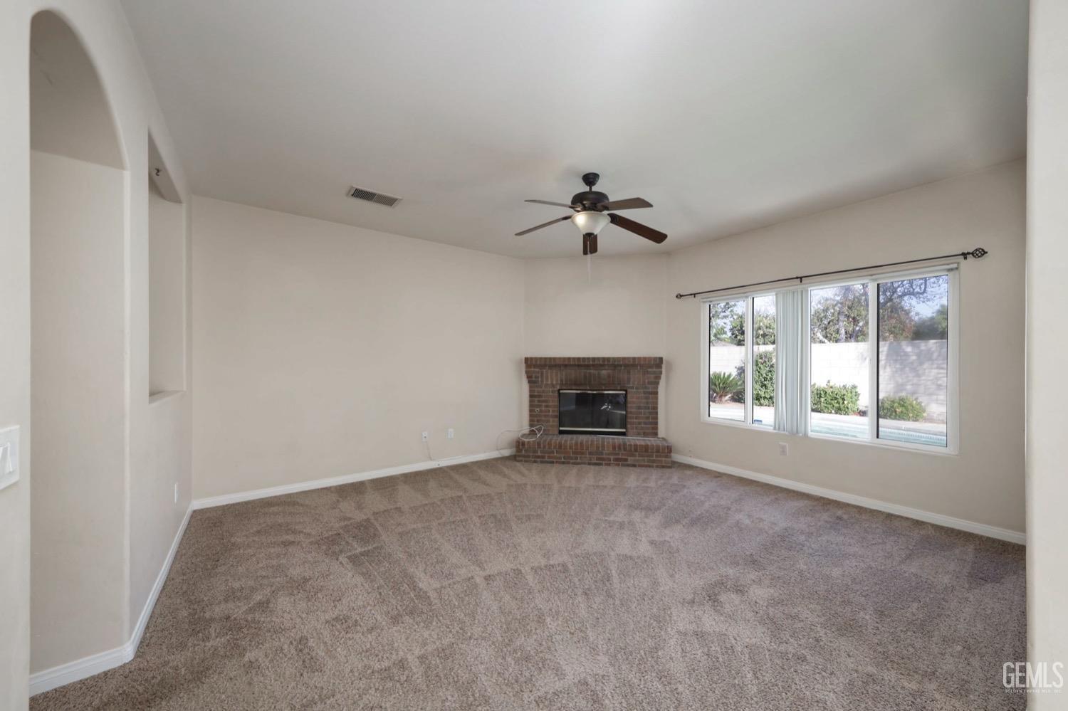 Undisclosed Address Bakersfield, CA 93312 - Photo 14 of 38 a view of an empty room with a window