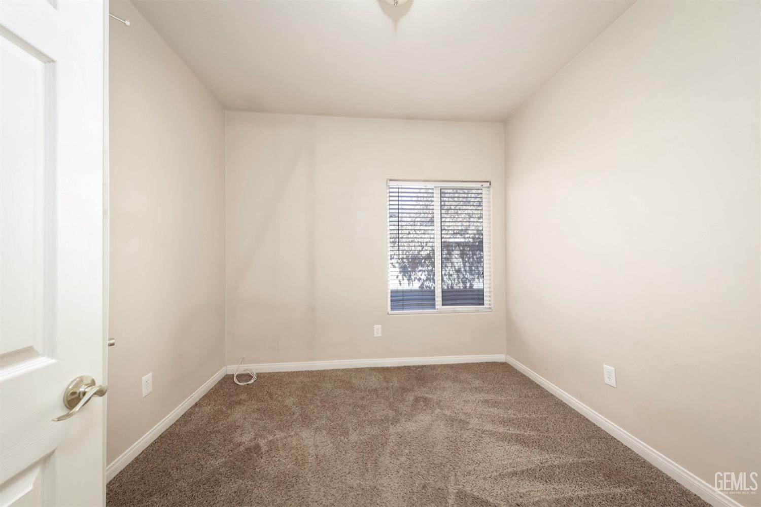 Undisclosed Address Bakersfield, CA 93312 - Photo 17 of 38 an empty room with a window