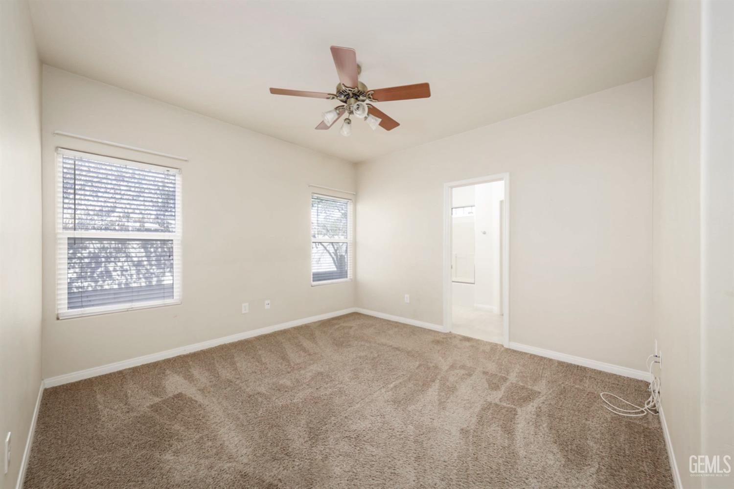 Undisclosed Address Bakersfield, CA 93312 - Photo 22 of 38 a view of an empty room with a window