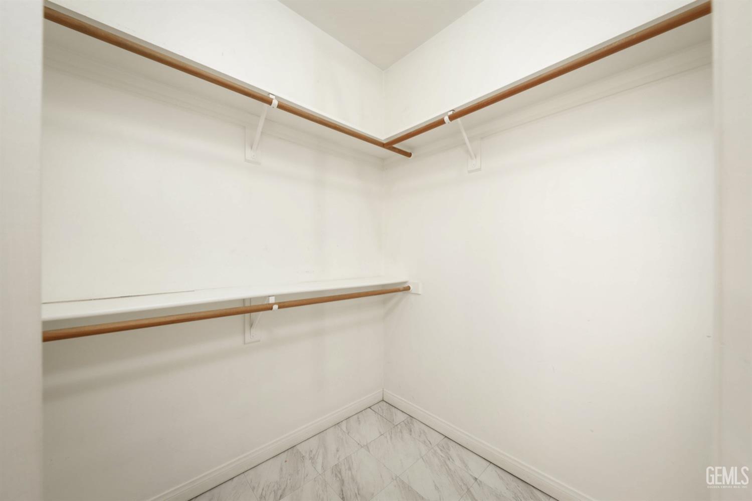 Undisclosed Address Bakersfield, CA 93312 - Photo 24 of 38 a view of a room with racks on the wall