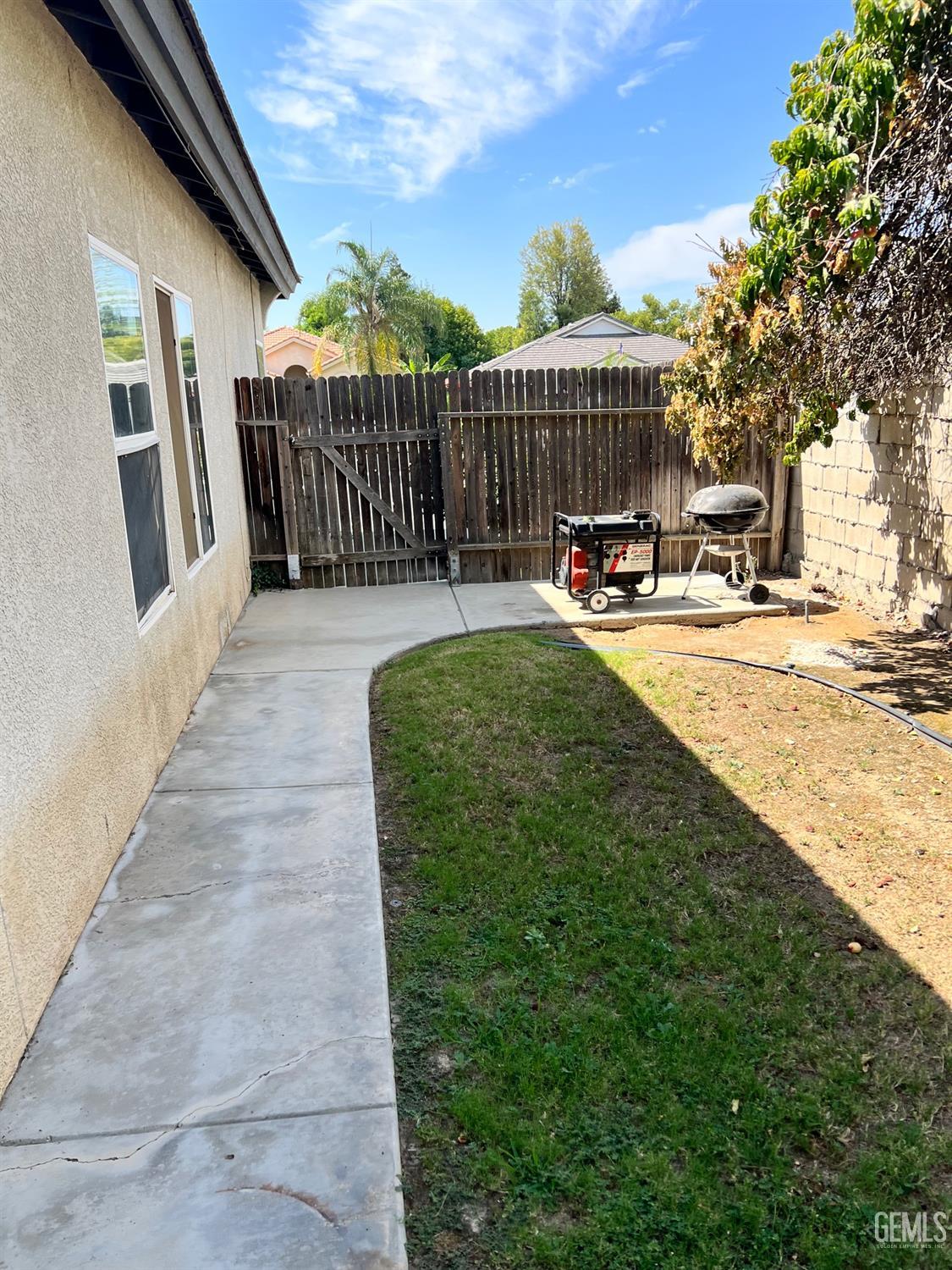 Undisclosed Address Bakersfield, CA 93312 - Photo 27 of 38 a view of a house with a yard