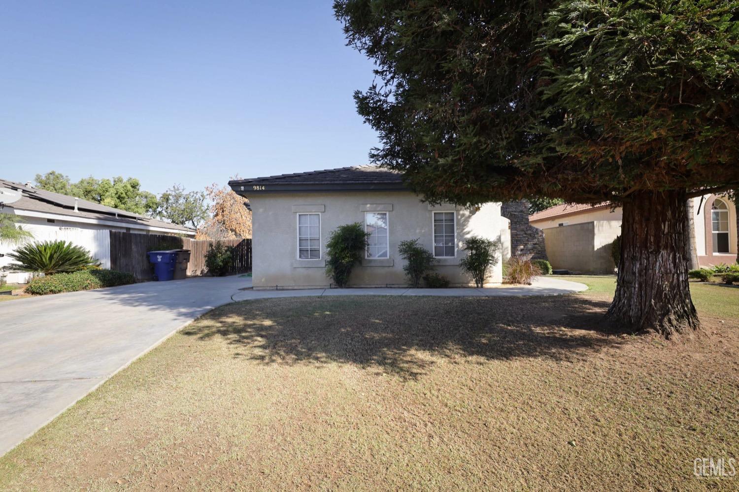 Undisclosed Address Bakersfield, CA 93312 - Photo 31 of 38 a view of a house with a yard and tree s