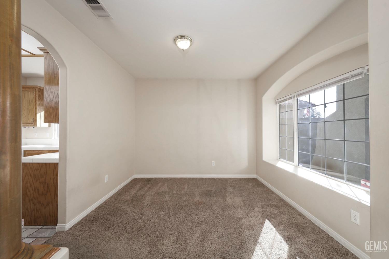 Undisclosed Address Bakersfield, CA 93312 - Photo 6 of 38 a view of an empty room with a window