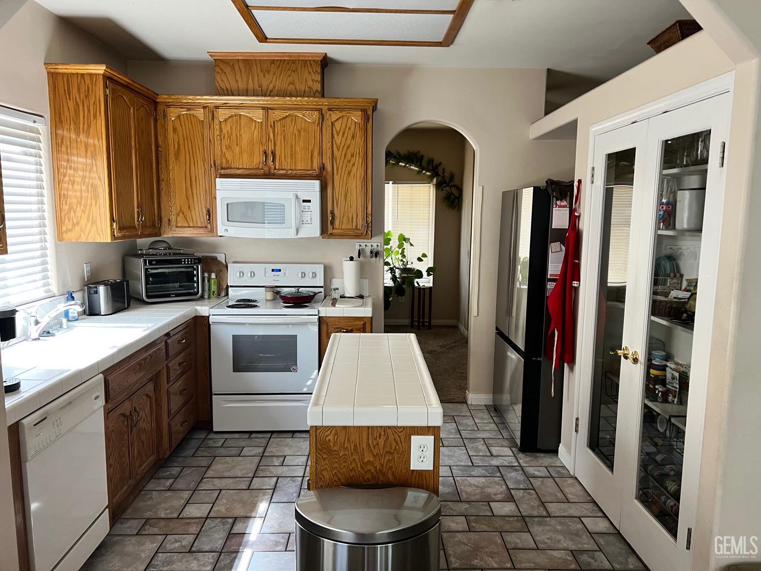 Undisclosed Address Bakersfield, CA 93312 - Photo 8 of 38 a kitchen with a sink cabinets and window