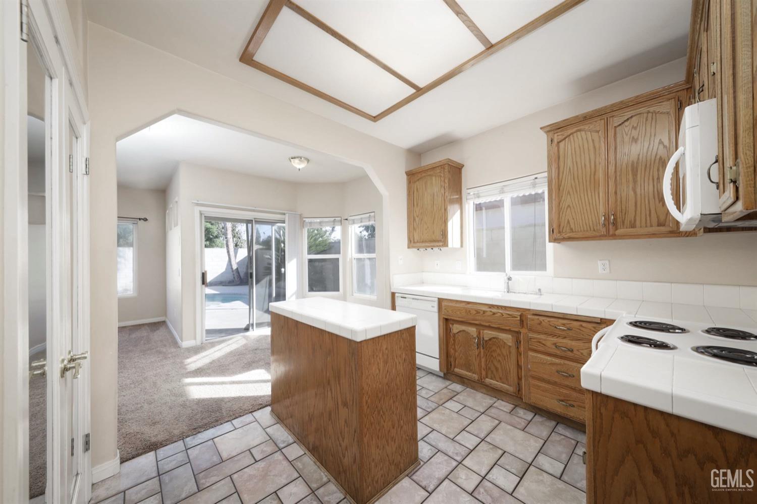 Undisclosed Address Bakersfield, CA 93312 - Photo 9 of 38 a kitchen with a sink and a stove top oven