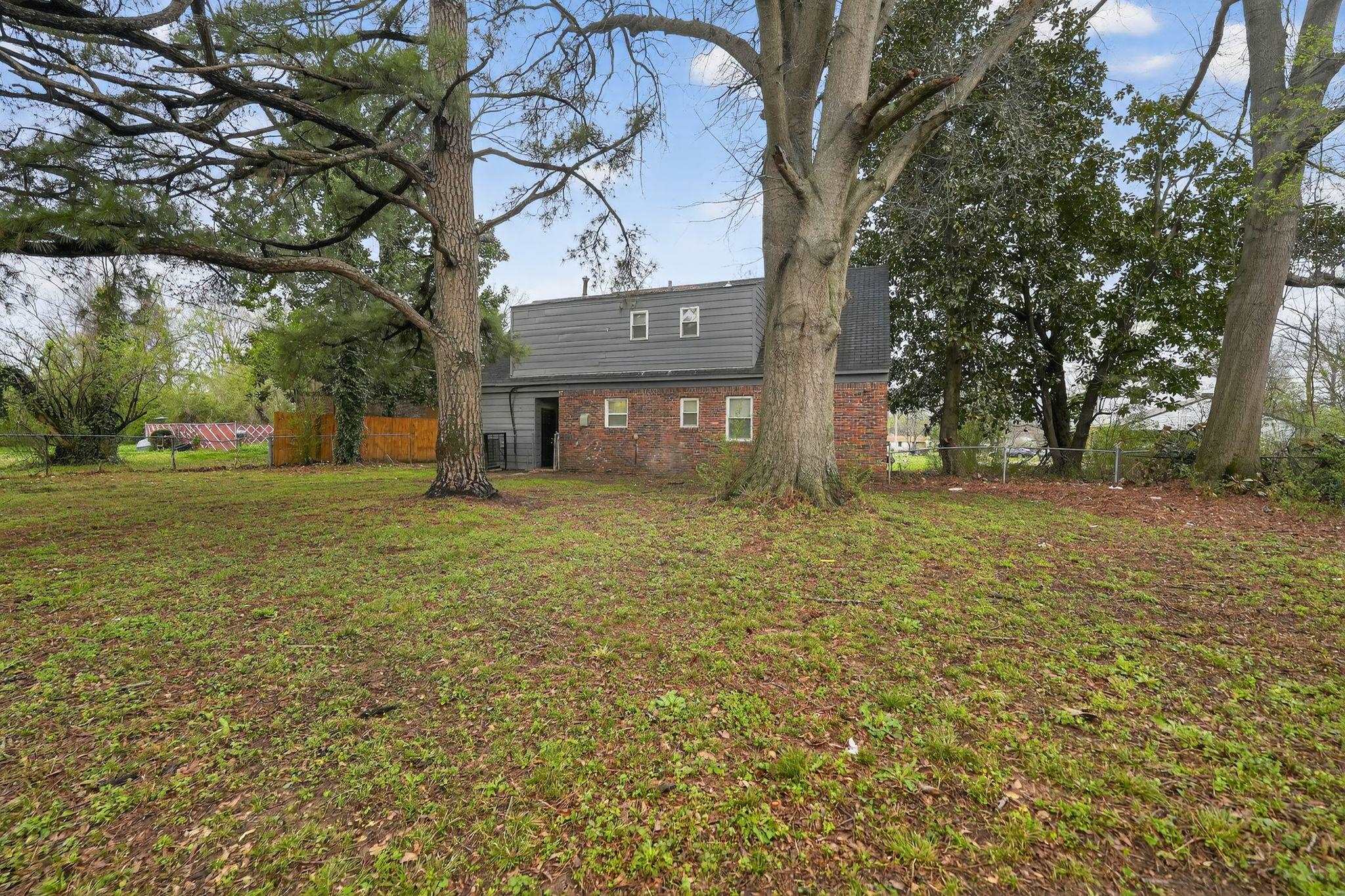 4646 Applegate Road Memphis, TN 38109 - Photo 18 of 37 a view of a house with a yard