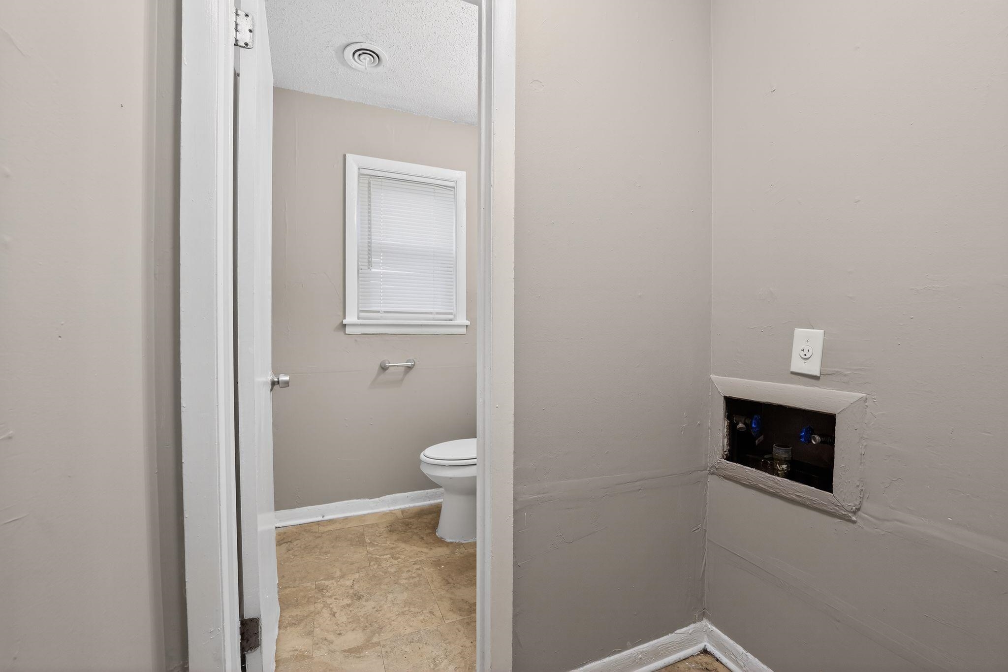 4646 Applegate Road Memphis, TN 38109 - Photo 21 of 37 a bathroom with a toilet and a sink