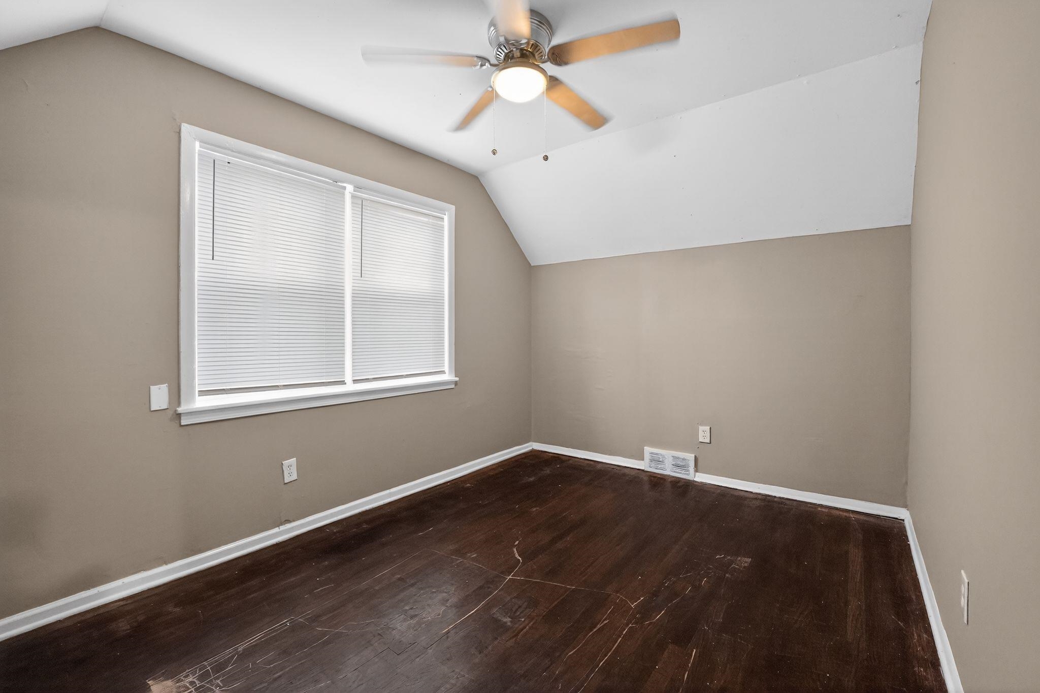 4646 Applegate Road Memphis, TN 38109 - Photo 23 of 37 an empty room with a window and a fan