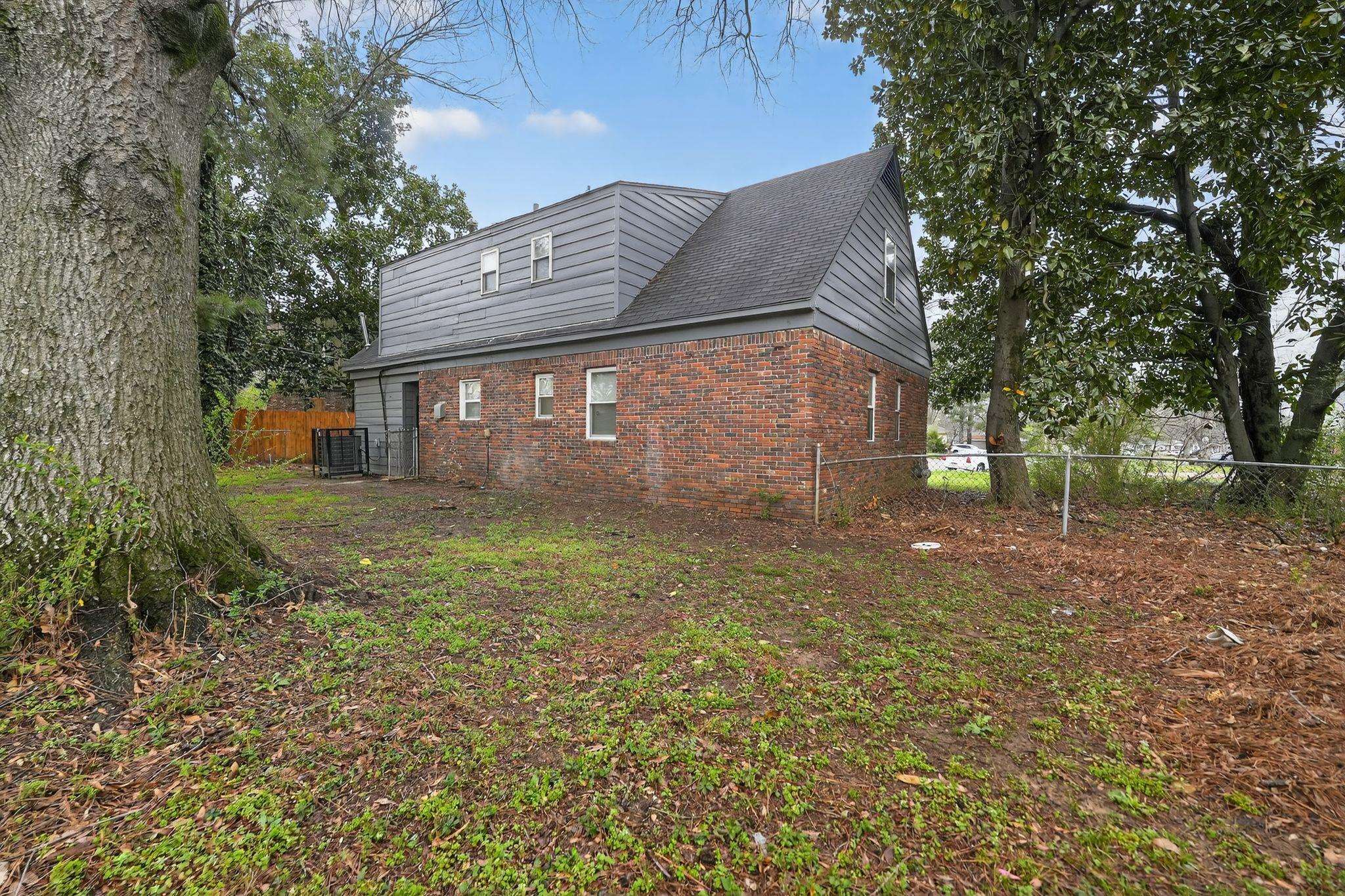 4646 Applegate Road Memphis, TN 38109 - Photo 27 of 37 a view of a house with a yard