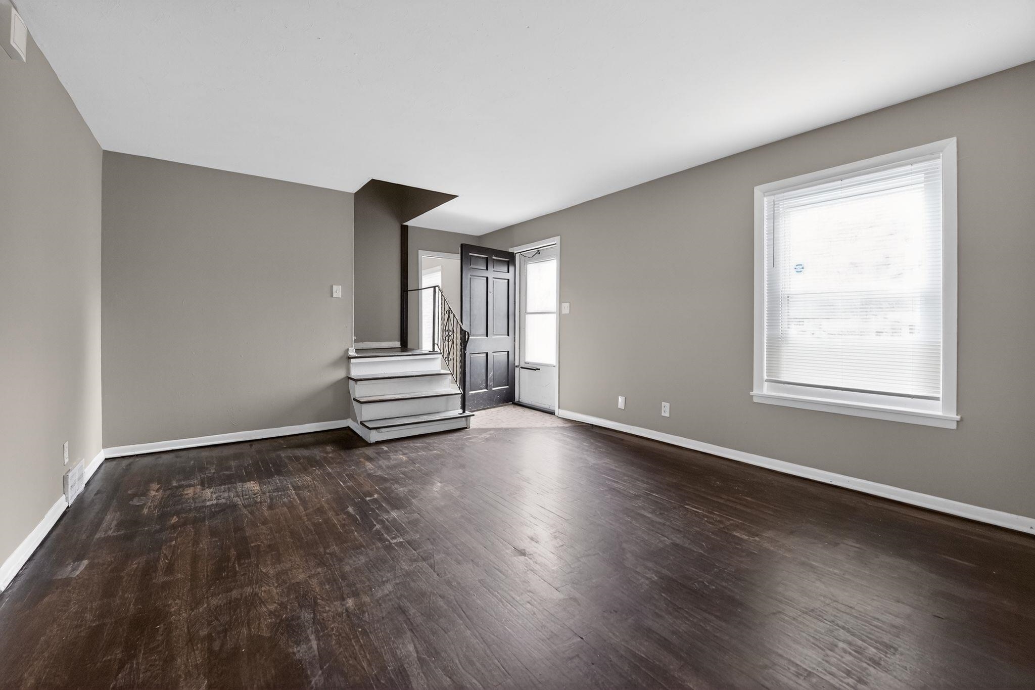 4646 Applegate Road Memphis, TN 38109 - Photo 35 of 37 a view of a livingroom with wooden floor and a window