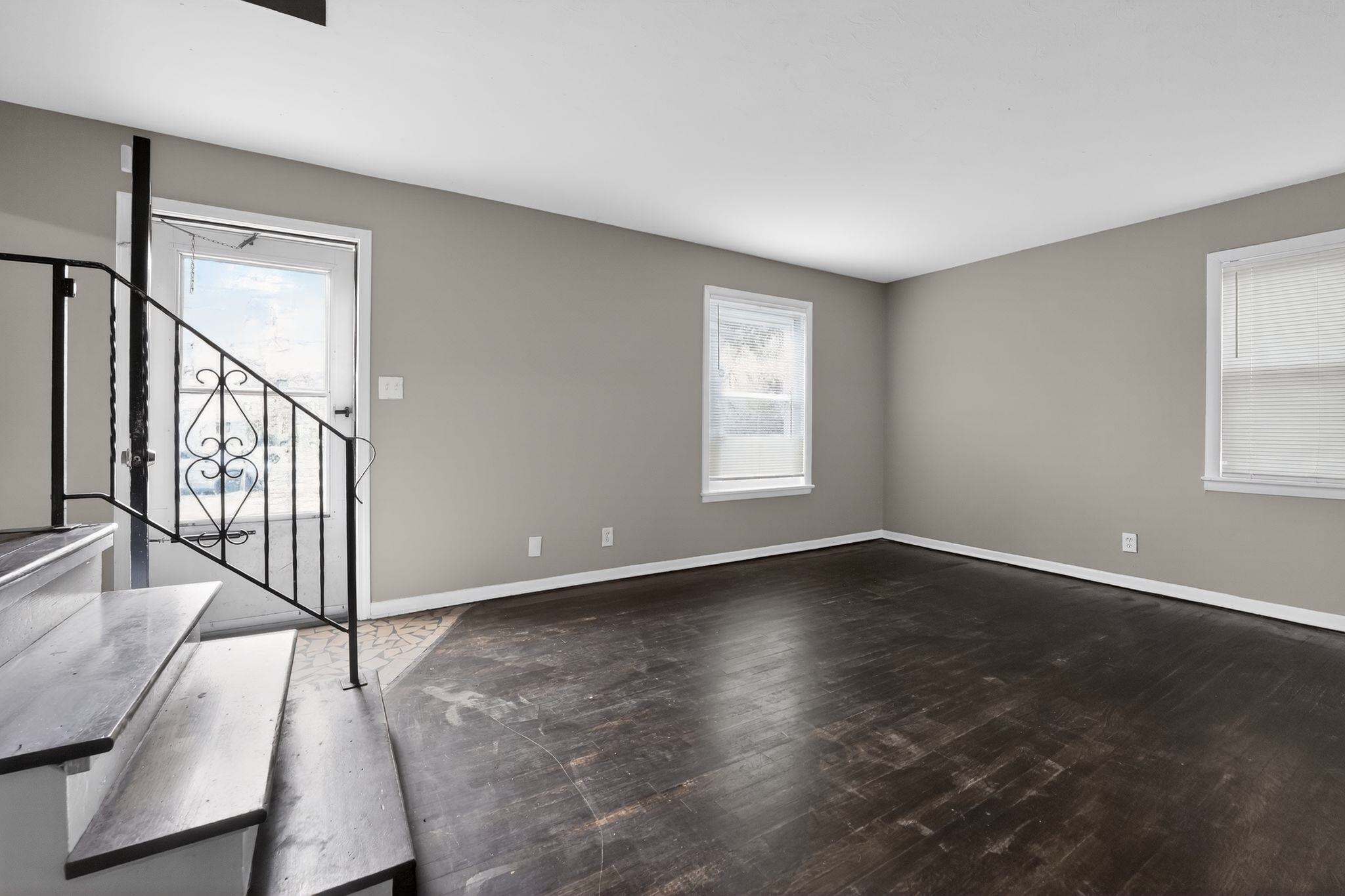 4646 Applegate Road Memphis, TN 38109 - Photo 36 of 37 a view of an empty room with wooden floor and a window
