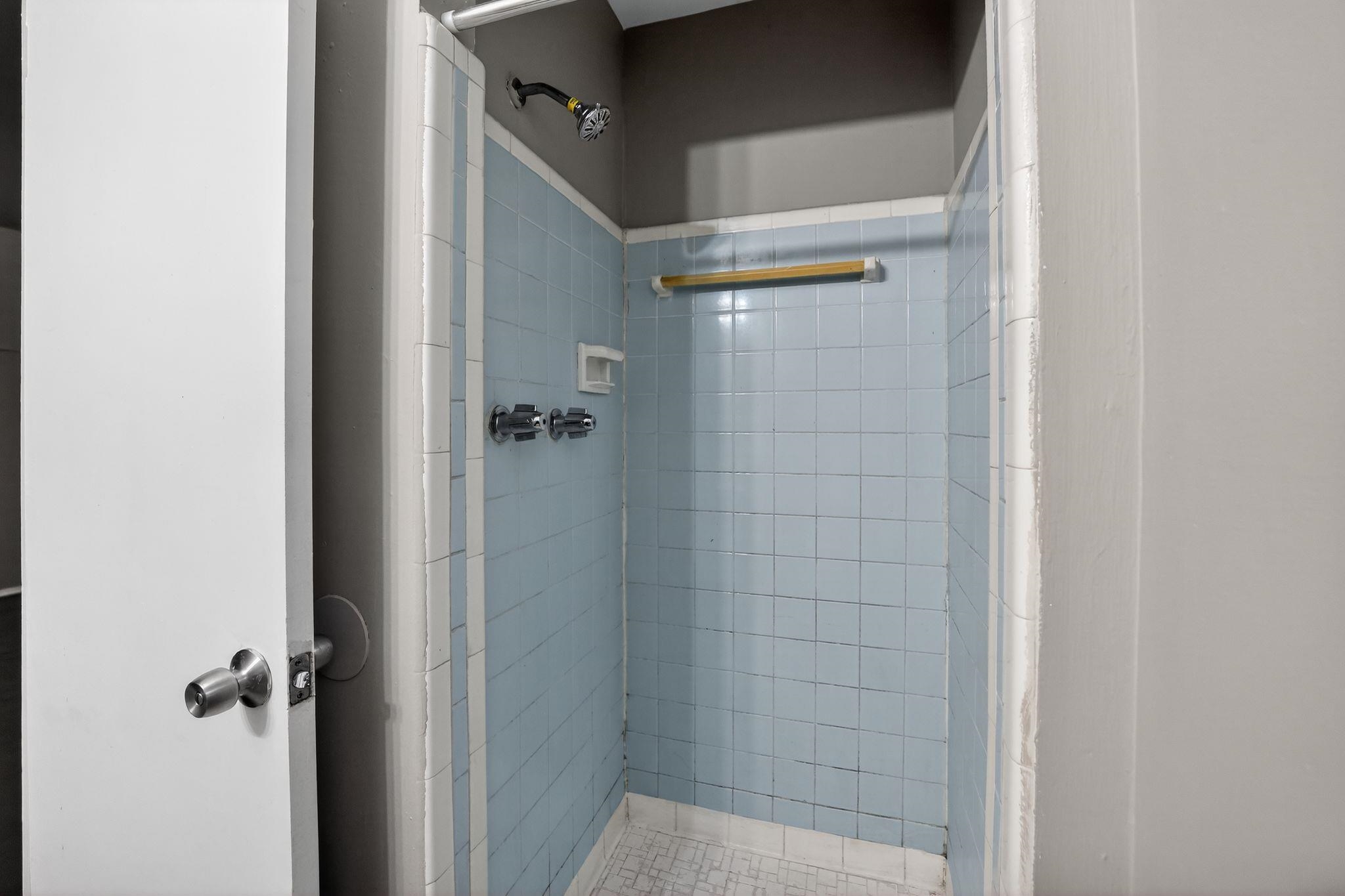 4646 Applegate Road Memphis, TN 38109 - Photo 10 of 37 a bathroom with a glass door shower