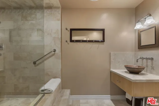 a bathroom with a shower and toilet