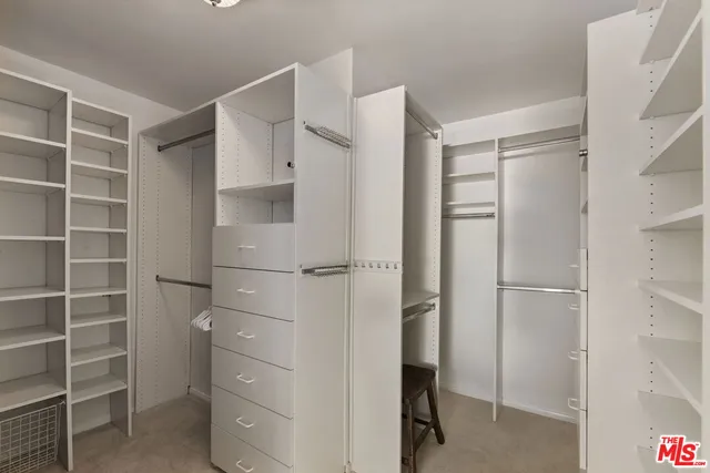 a bedroom with a bed and a night stand