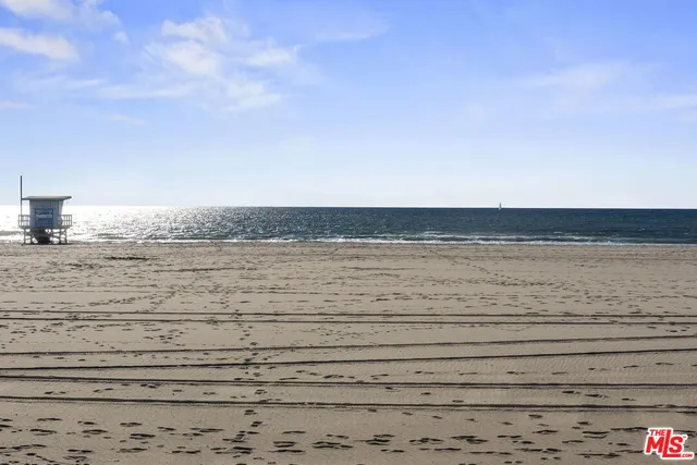 a view of an ocean with a mountain