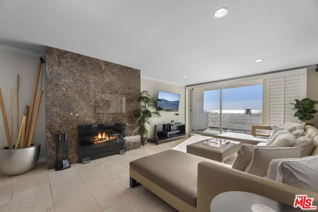 a living room with furniture a bike and a window