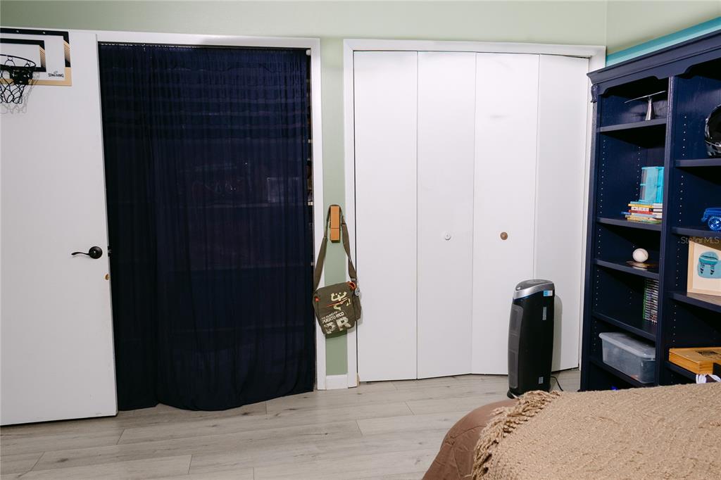 18305 Oakdale Road Odessa, FL 33556 - Photo 27 of 42 a bedroom with a bed and a closet