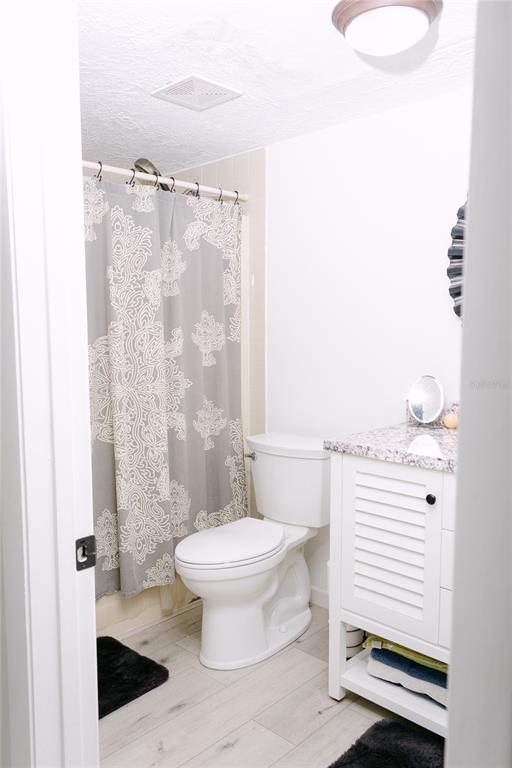 18305 Oakdale Road Odessa, FL 33556 - Photo 29 of 42 a bathroom with a toilet and a shower