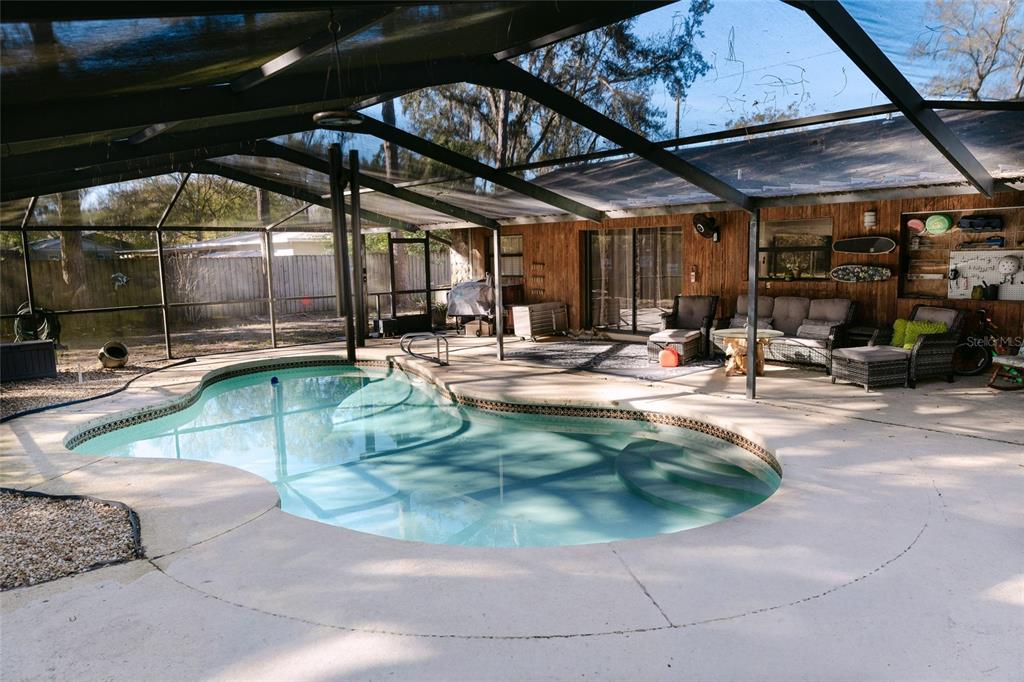 18305 Oakdale Road Odessa, FL 33556 - Photo 5 of 42 a view of a swimming pool with a patio