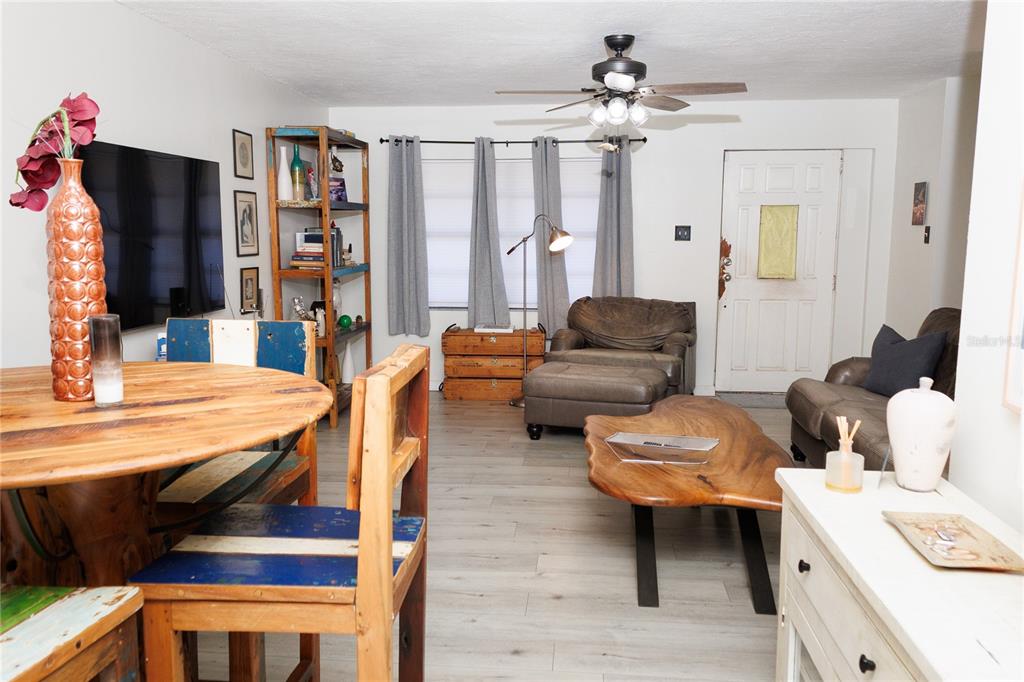 18305 Oakdale Road Odessa, FL 33556 - Photo 8 of 42 a living room with furniture and a flat screen tv
