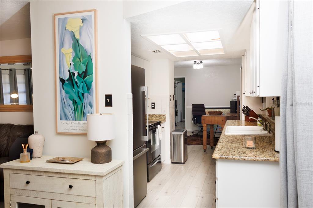 18305 Oakdale Road Odessa, FL 33556 - Photo 9 of 42 a kitchen with a refrigerator and a sink