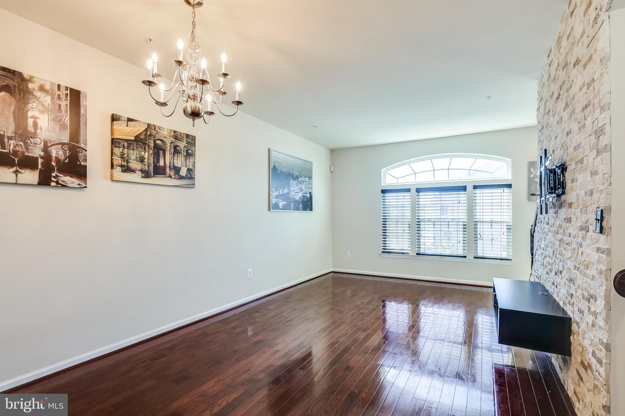 7227 Abbey Road Elkridge, MD 21075 - Photo 8 of 32 HARDWOOD FLOOR S AND CUSTOM BRICK WALL