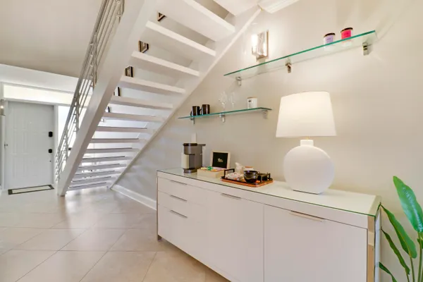 a room with a white cabinets and wooden floor