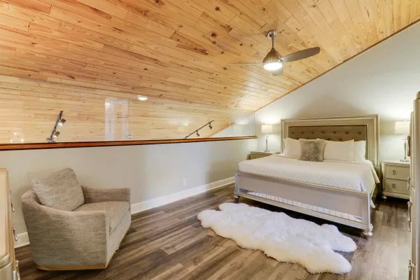 a bedroom with a bed and window