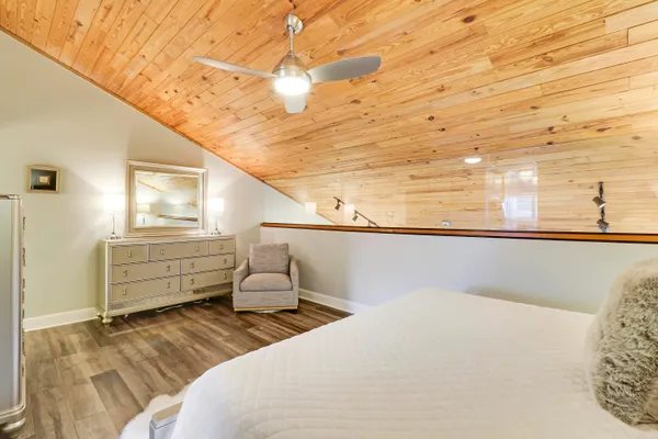 a bedroom with a bed and cabinets