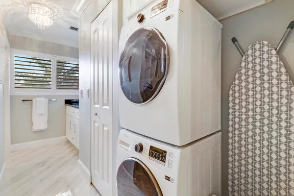 a view of a storage & utility room with dryer and washer