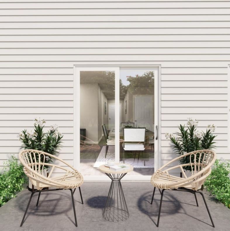 100 Keith Place Roxboro, NC 27573 - Photo 5 of 7 a balcony with chairs and potted plant