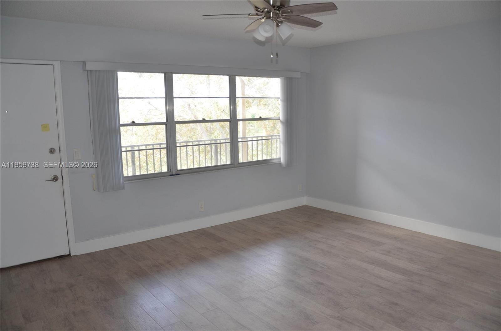 13475 Southwest 9th Street, Unit 407A Pembroke Pines, FL 33027 - Photo 3 of 15 an empty room with a window