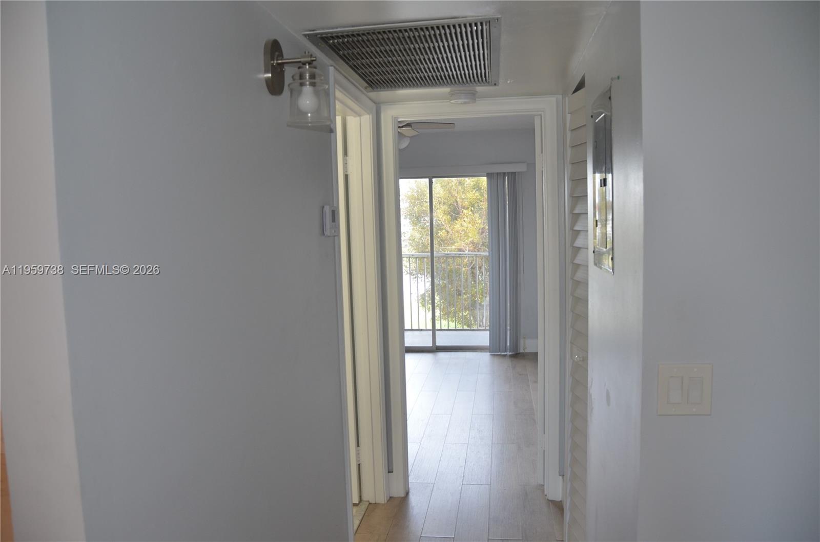 13475 Southwest 9th Street, Unit 407A Pembroke Pines, FL 33027 - Photo 9 of 15 a view of an entryway with wooden floor
