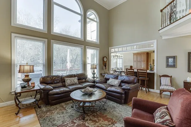 a kitchen with a stove a sink dishwasher a refrigerator and cabinets with wooden floor