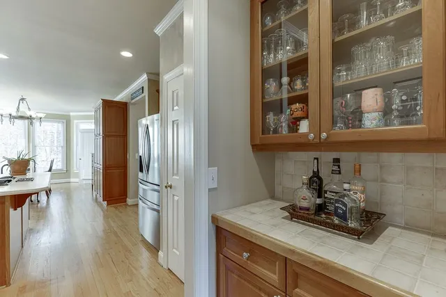 a room with wooden floor and furniture