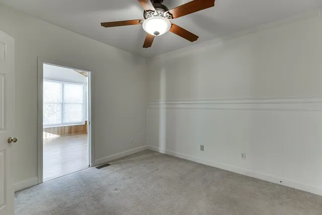 a bathroom with a granite countertop sink a large mirror and a shower