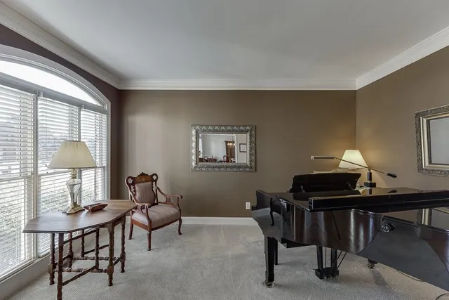 a view of a dining room with furniture wooden floor and chandelier