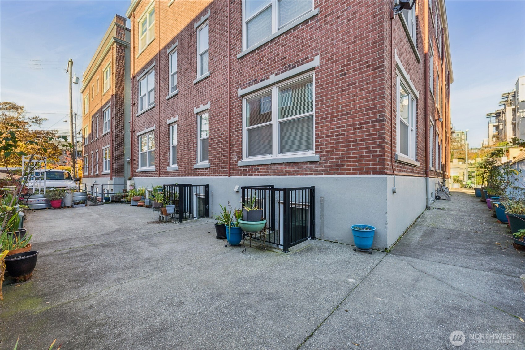 905 Northeast 43rd Street, Unit 108 Seattle, WA 98105 - Photo 20 of 28 a view of a building with sitting area