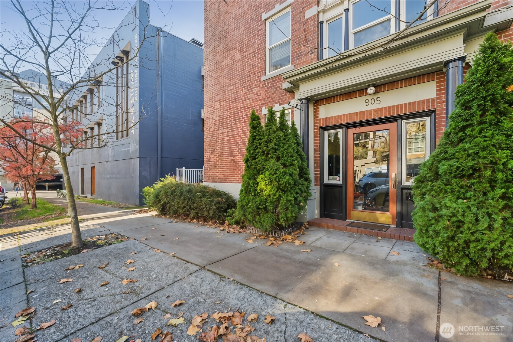 905 Northeast 43rd Street, Unit 108 Seattle, WA 98105 - Photo 2 of 28 front view of a brick house with a large window