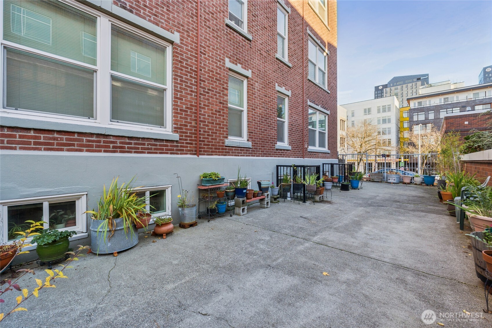 905 Northeast 43rd Street, Unit 108 Seattle, WA 98105 - Photo 21 of 28 a view of a building with sitting area