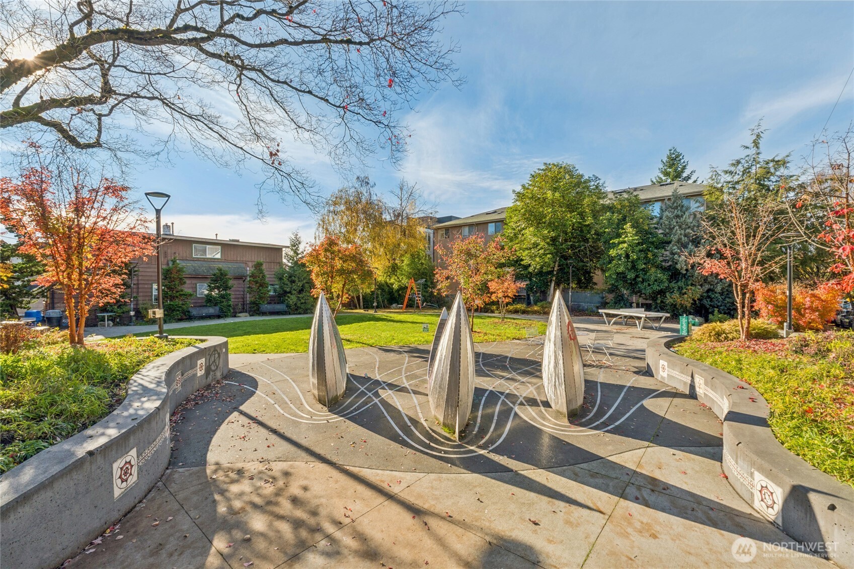 905 Northeast 43rd Street, Unit 108 Seattle, WA 98105 - Photo 23 of 28 a view of a swimming pool with a patio and a yard