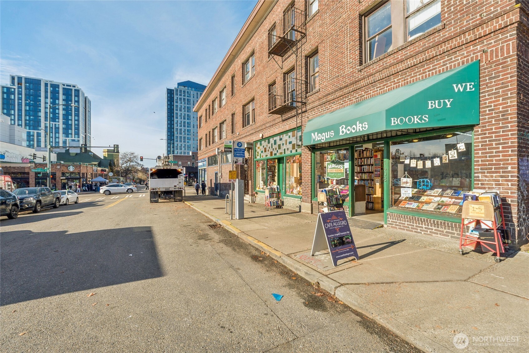 905 Northeast 43rd Street, Unit 108 Seattle, WA 98105 - Photo 25 of 28 a view of a building with sitting area