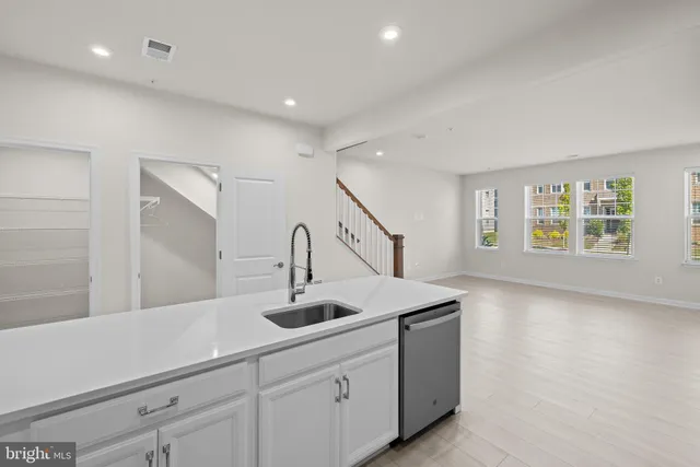 a kitchen with sink and window