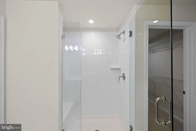 a bathroom with a double vanity sink and mirror
