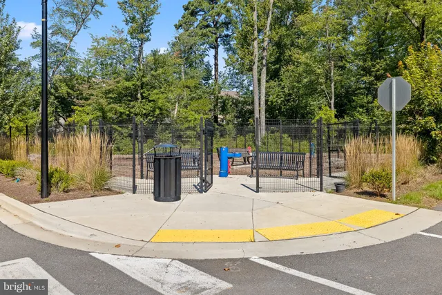 a view of park with iron fence