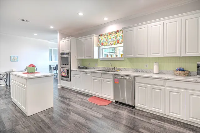 a view of a refrigerator in kitchen and wooden floor