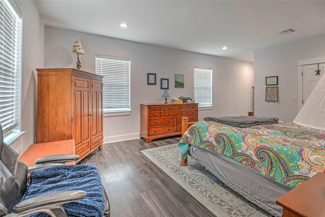 a bedroom with a bed and a dresser